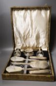 A late 1940's cased silver mounted eight piece dressing table set with atomiser, scent bottle and