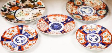 Five Japanese Imari dishes, largest 30.5 cm