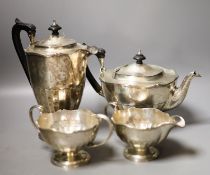 A George V four piece silver circular tea set, Fenton, Russel & Co Ltd, Birmingham, 1912,gross