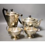 A George V four piece silver circular tea set, Fenton, Russel & Co Ltd, Birmingham, 1912,gross