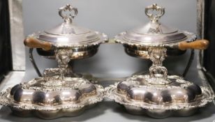 A pair of cast plated shaped oval entree dishes and covers and pair of linked cast plated