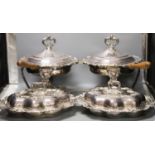 A pair of cast plated shaped oval entree dishes and covers and pair of linked cast plated