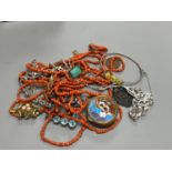 A small group of assorted minor jewellery including a white metal brooch, coral necklace etc. in a