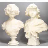 Two white alabaster busts of young women, raised on turned plinths44cm