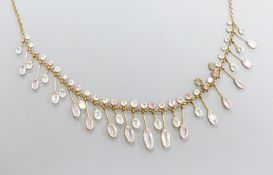 A 9k, aquamarine and pink topaz set drop fringe necklace, approx. 46cm,gross weight 14.8 grams.