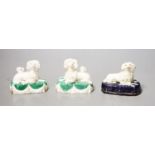 Three Staffordshire porcelain groups of a poodle and puppies, c.1830–50Provenance - Dennis G. Rice