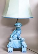A Chinese turquoise glazed Buddhist lion table lamp and a pair of small lions (3)