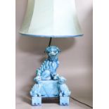 A Chinese turquoise glazed Buddhist lion table lamp and a pair of small lions (3)