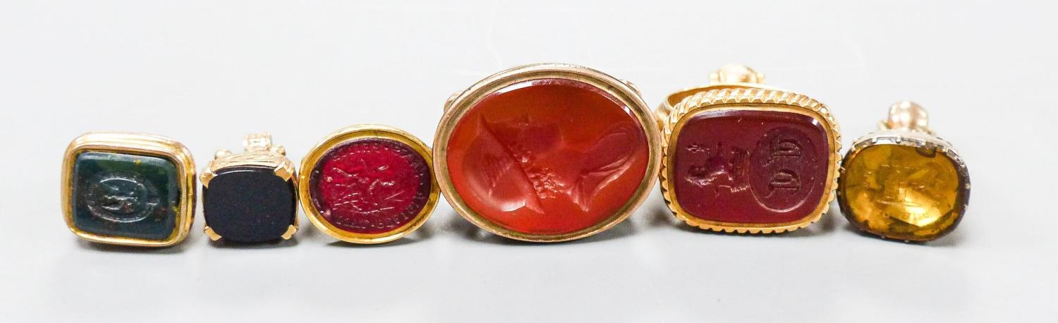 A collection of six 19th century and late assorted yellow metal overlaid and chalcedony set fob seal - Image 2 of 4