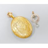A Victorian engraved yellow metal oval locket, with engraved initials, 47mm, gross 31.6 grams,