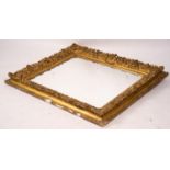 An ornate Victorian giltwood and gesso rectangular wall mirror (formerly a picture frame) width