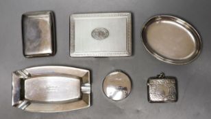Two silver cigarette cases, largest 10.8cm, a silver vesta case, circular pill box, ashtray and