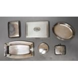 Two silver cigarette cases, largest 10.8cm, a silver vesta case, circular pill box, ashtray and