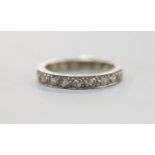 An engraved white metal and diamond set full eternity ring, size P, gross weight 4.1 grams.