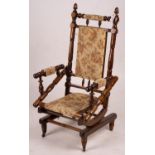 An early 20th century American turned mahogany rocking chair