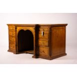 A late Victorian banded satinwood kneehole desk, width 138cm, depth 67cm, height 71cm