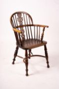 A 19th century yew and elm Yorkshire area Windsor elbow chair with crinoline stretcher, width