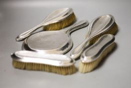 An Edwardian matched part planished silver five piece mirror and brush set, Saunders & Shepherd,