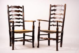 A pair of early 19th century Lancashire ash and fruitwood rush seat ladderback elbow chairs, width