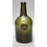 A George III green glass sealed wine bottle, dated 177826cm