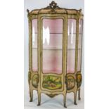 A Louis XV style cream and polychrome painted, ormolu mounted vitrine, of bombe shape, with vernis
