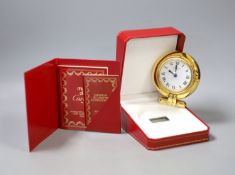 A cased Cartier gilt metal travelling timepiece