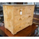 A Victorian stripped pine chest of drawers (lacking feet), width 95cm, depth 53cm, height 74cm