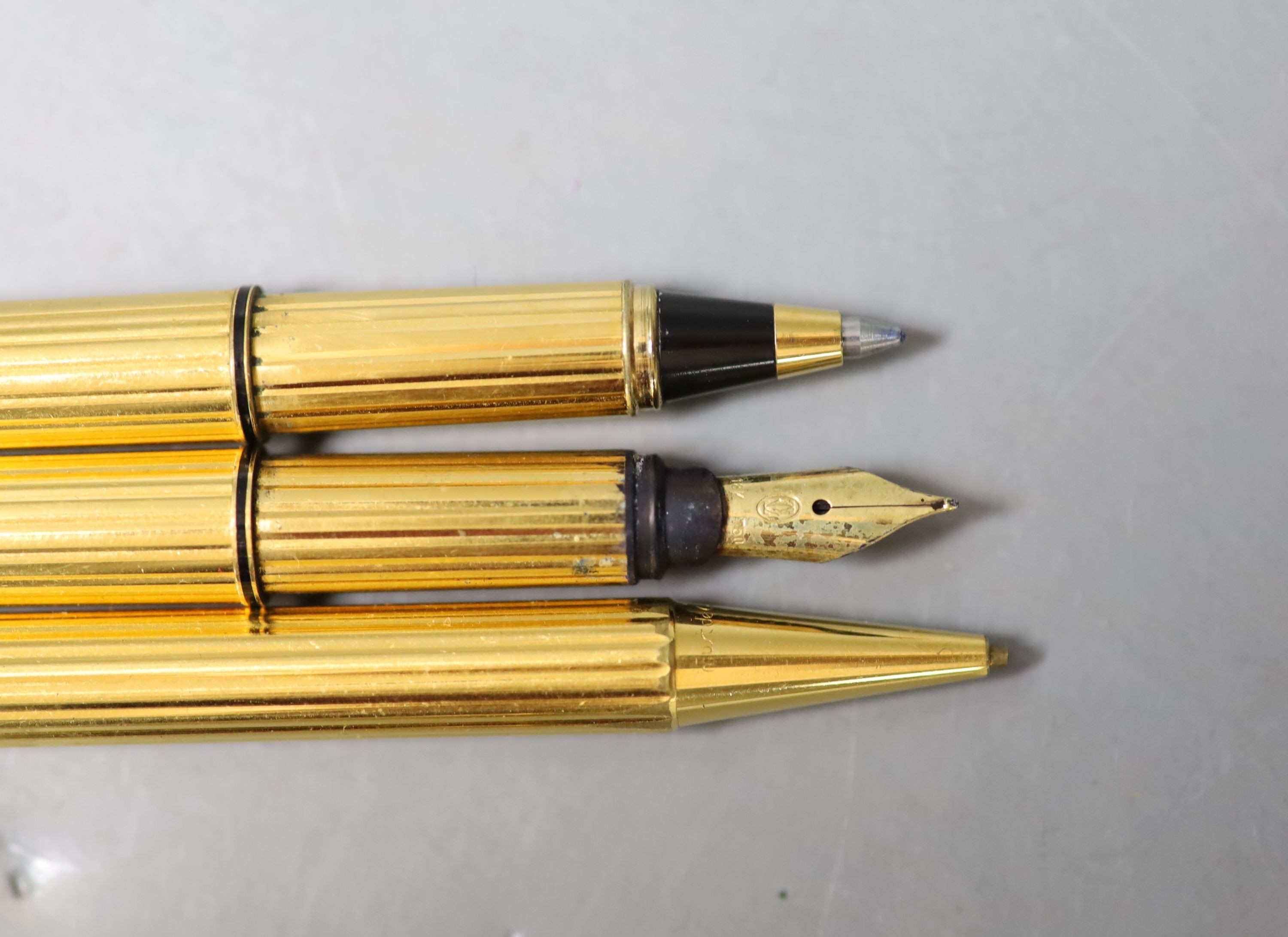 A Cartier gilt metal fountain pen, ball point pen and propelling pencil - Image 3 of 3