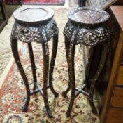 A pair of Chinese mother of pearl inset hardwood vase stands, height 92cm