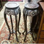 A pair of Chinese mother of pearl inset hardwood vase stands, height 92cm