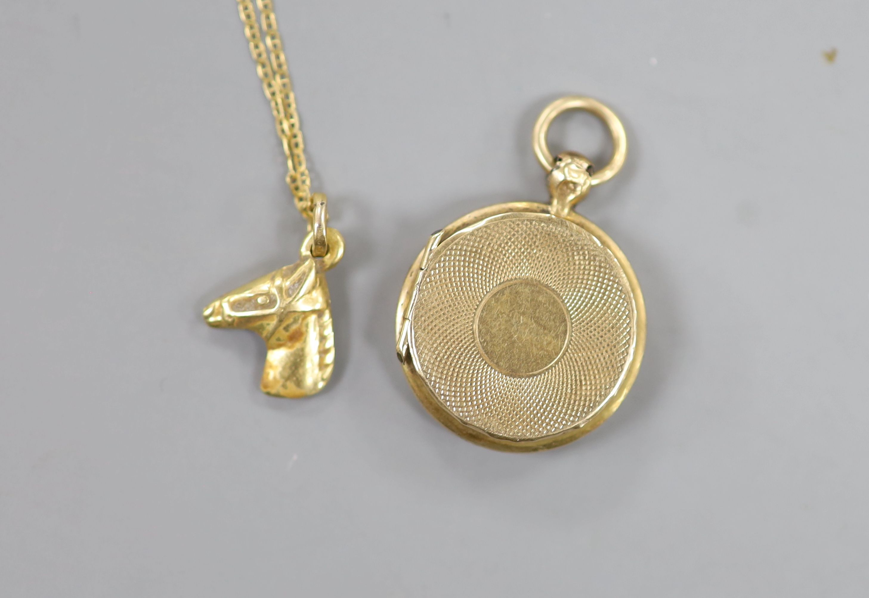 A small early 20th century yellow metal and enamel pendant locket, 18mm, together with a very - Image 2 of 3