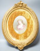 A Royal Doulton oval plaque, signed Leslie Johnson, hand painted with a portrait of a lady, in gesso