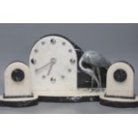 An Art Deco clock garniture, with stork surmount, clock width 41cm (modified quartz movement)