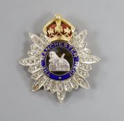 A late 19th/early 20th century yellow metal, enamel and rose cut diamond set 'The Manchester Regt.
