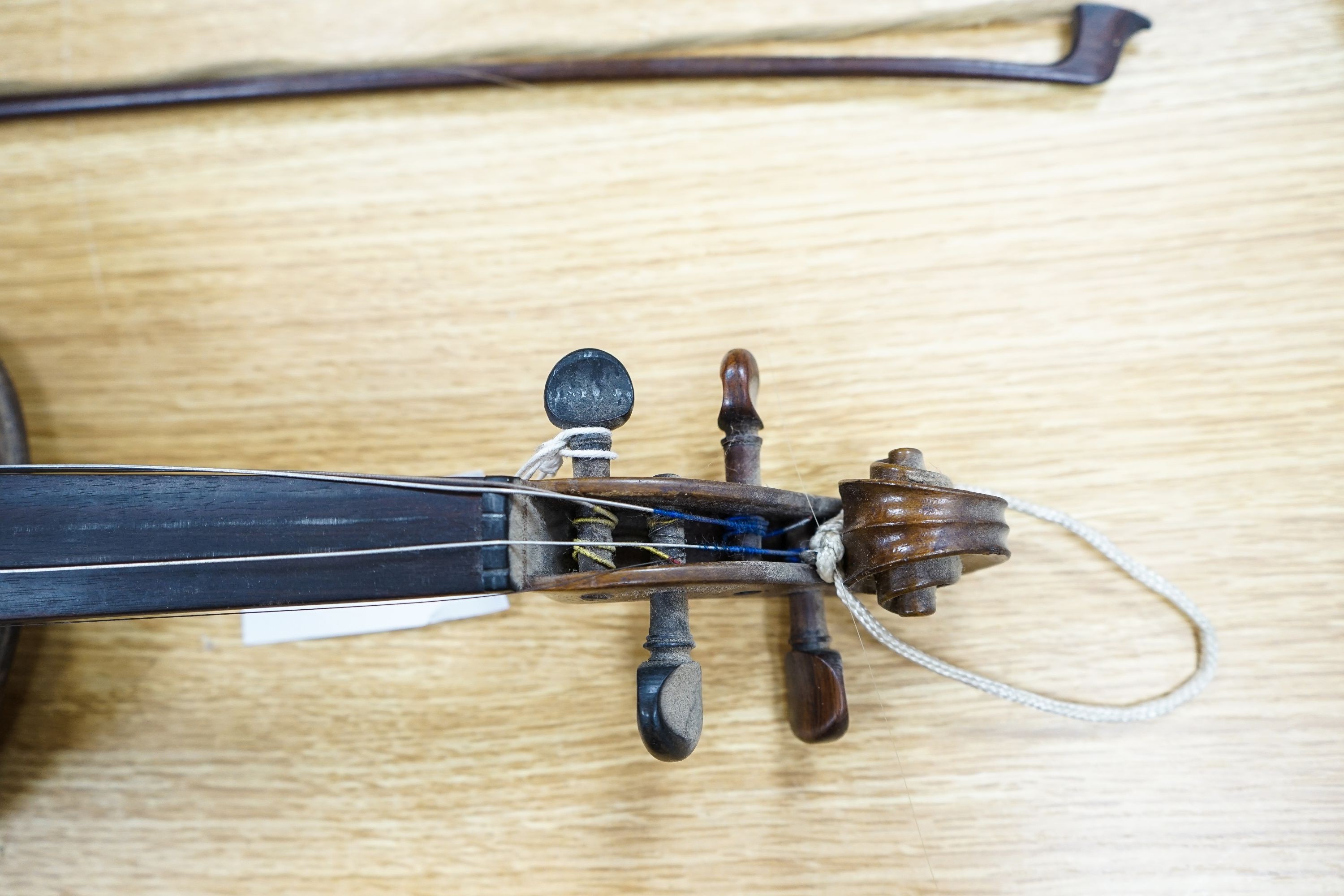 A violin labelled Francesco Ruggeri and a bow. Back of violin excluding button - 36cm - Image 2 of 2
