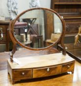 An early 19th century mahogany bowfront box base toilet mirror, width 54cm, depth 21cm, height 54cm