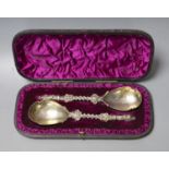 A cased pair of Victorian silver apostle spoons, Charles Boyton II, London, 1884, 20cm, 6oz.