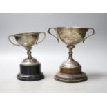 Two early to mid 20th century silver two handled presentation trophy cups, tallest 14cm (a.f.),gross