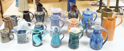 A group of studio pottery jugs to include -Pauline Zelinski geometric design, two Jennie Gilbert,