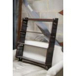 A George III style fret cut mahogany hanging four-tier wall shelf, width 70cm, depth 18cm, height