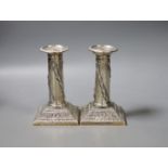 A pair of early 20th century repousse silver dwarf candlesticks, Thomas Bradbury & Sons,