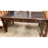 A reproduction oak two drawer writing table, W.160cm D.80cm H.78cm