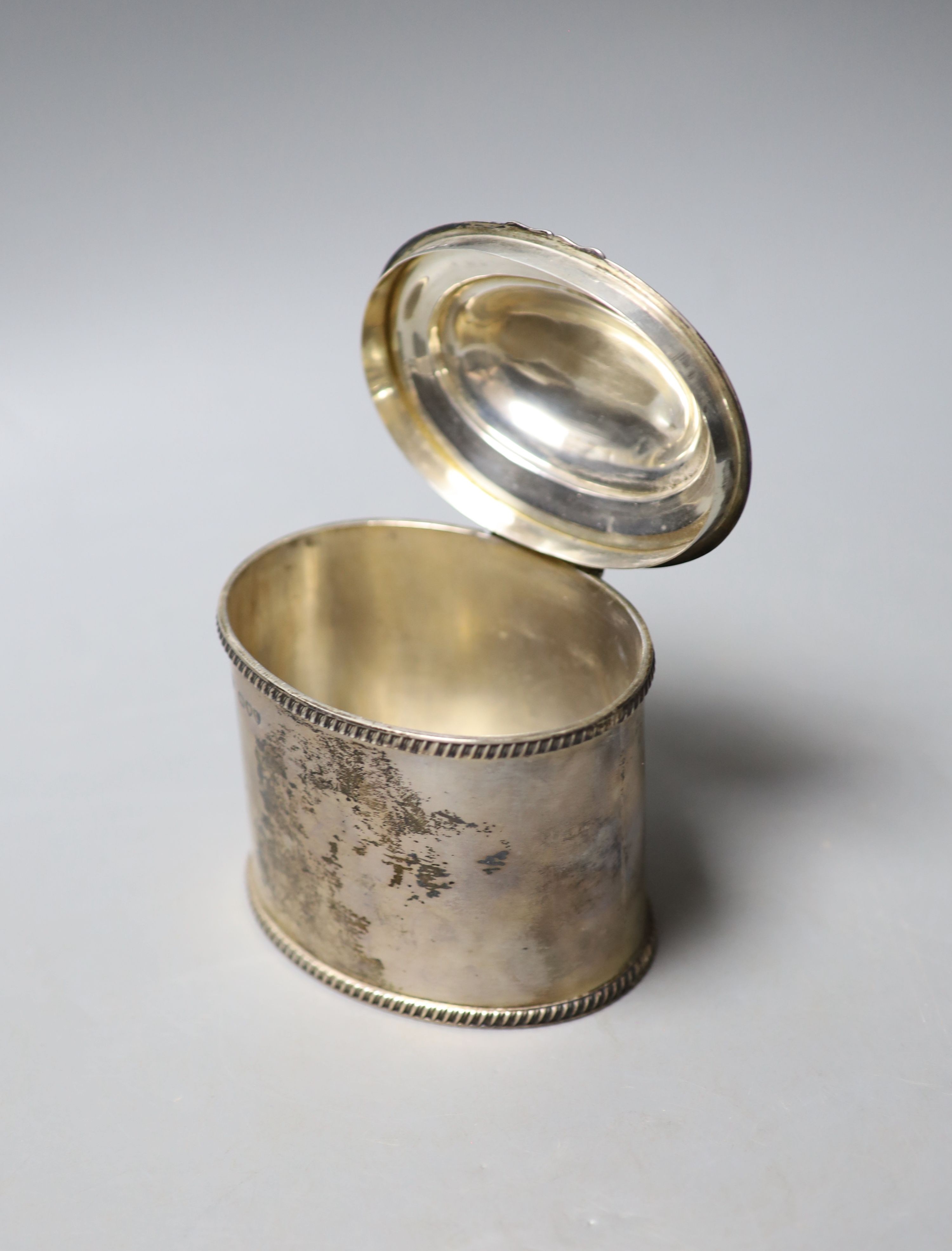 A late Victorian silver oval tea caddy, with gadrooned borders and hinged cover, Charles Stuart - Image 2 of 2