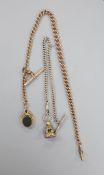 An Edwardian 9ct gold albert, hung with a 9ct gold and chalcedony set swivelling bob seal, albert