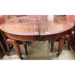 A Victorian mahogany circular extending dining table, (no leaves) length 140cm, depth 135cm,