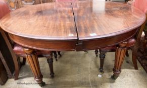 A Victorian mahogany circular extending dining table, (no leaves) length 140cm, depth 135cm,