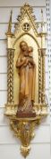 A 19th century architectural gilt niche and a 20th century carved pine group of Madonna and
