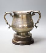 An Edwardian silver two handled presentation trophy cup, with later engraved inscription relating to