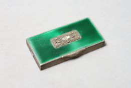 A 1930's engine turned silver, green enamel, marcasite and paste set minaudiere, lacking mirror