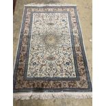 A North West Persian design ivory ground rug, 210 x 136cm
